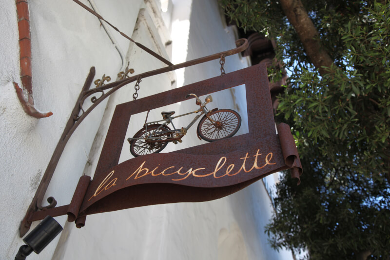 A Guide to Romance in Carmel-by-the-Sea La Bicyclette restaurant sign in Carmel-by-the-Sea, CA