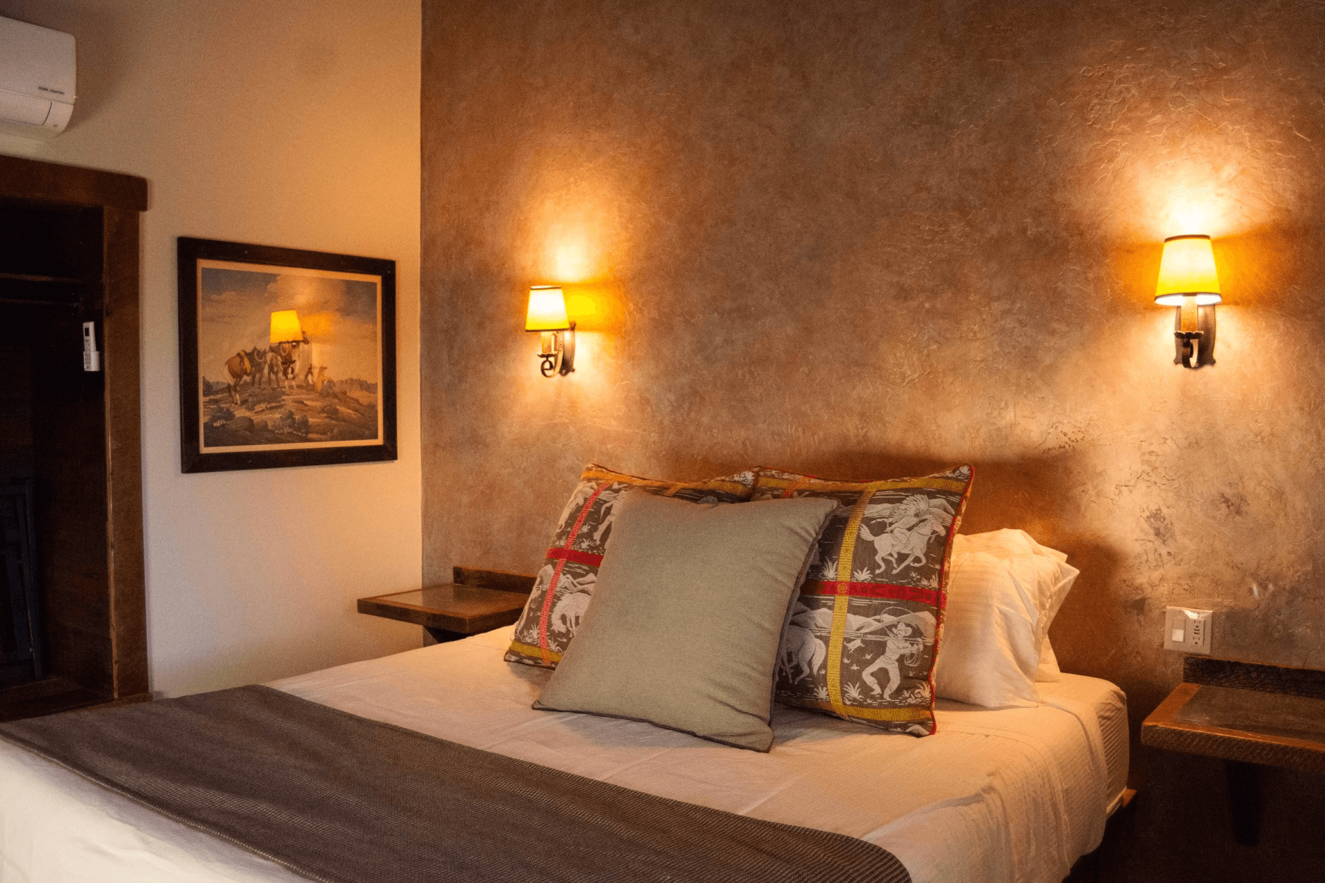 Interior cowboy themed hotel room in The Cowboy Cabin at Parkfield Lodge at V6 Ranch