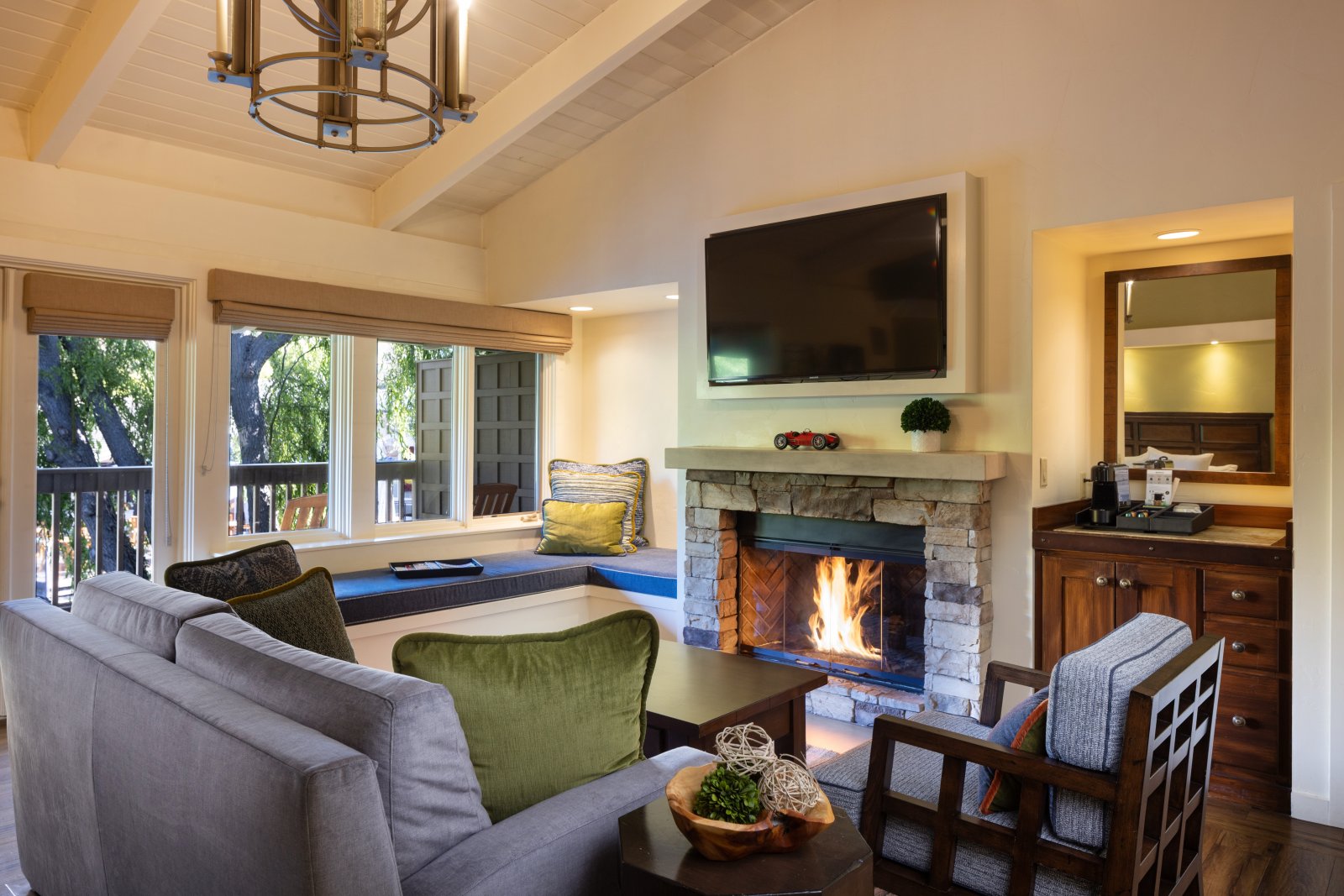 Car Lovers Guide to Monterey County Lobby with couch, fireplace and TV at The Quail in Carmel Valley, CA