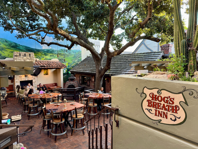Outdoor dining tables and chairs at Hog's Breath Inn restaurant in Carmel-by-the-Sea
