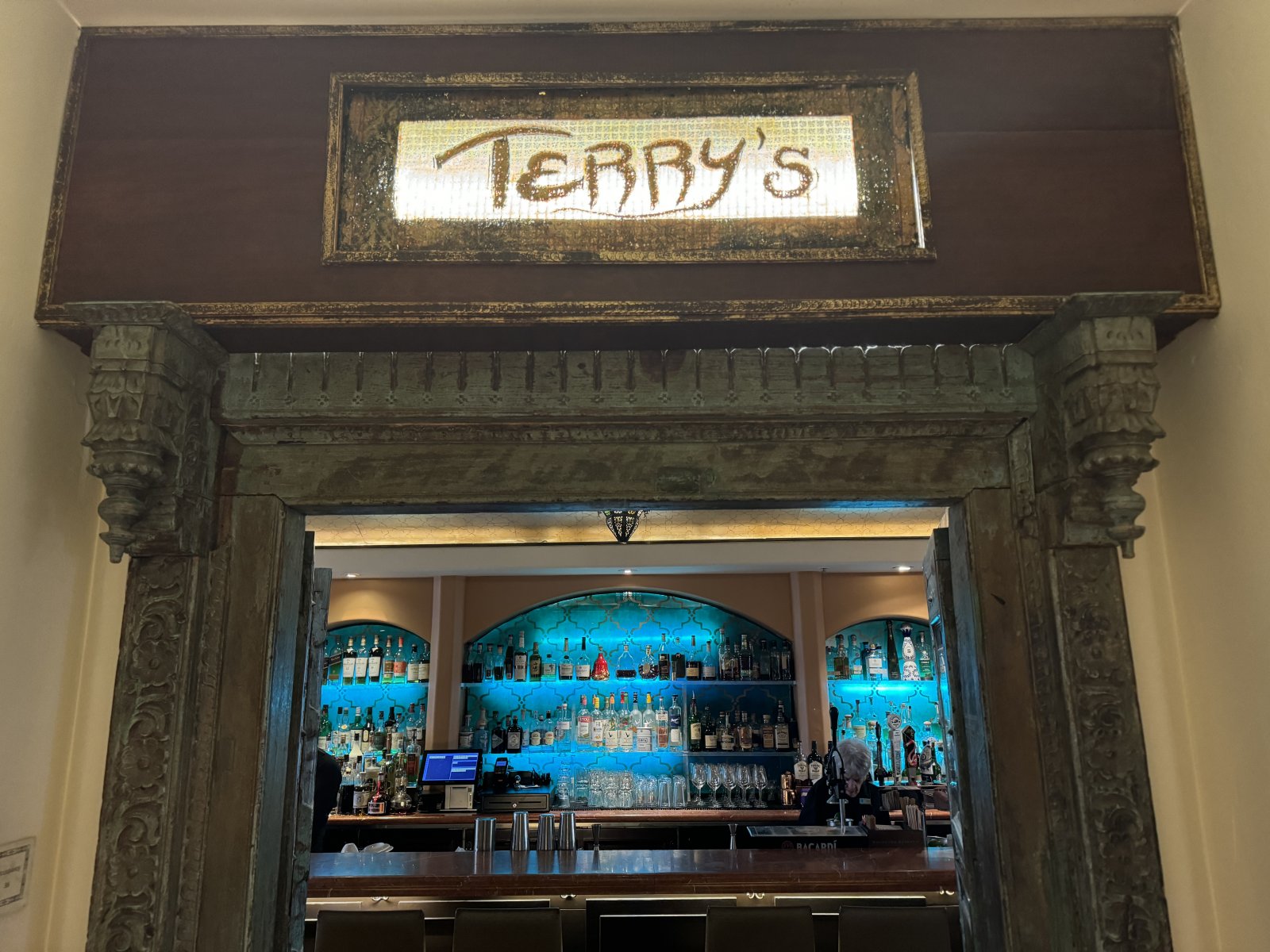 Where to Watch Free Live Music this Summer Sign for Terry's Lounge leading to bar in Carmel-by-the-Sea