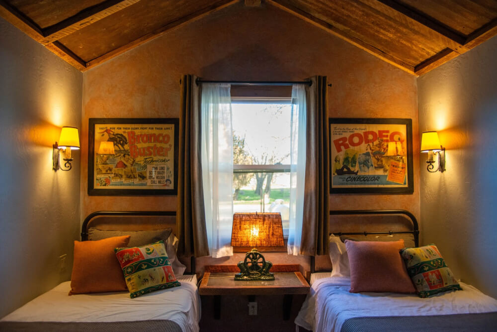 Interior cowboy themed hotel room in The Cowboy Cabin at Parkfield Lodge at V6 Ranch
