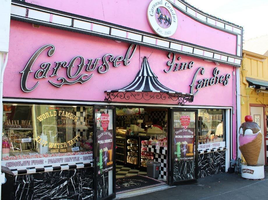 Exterior shot of pink building Carousel Candies in Monterey