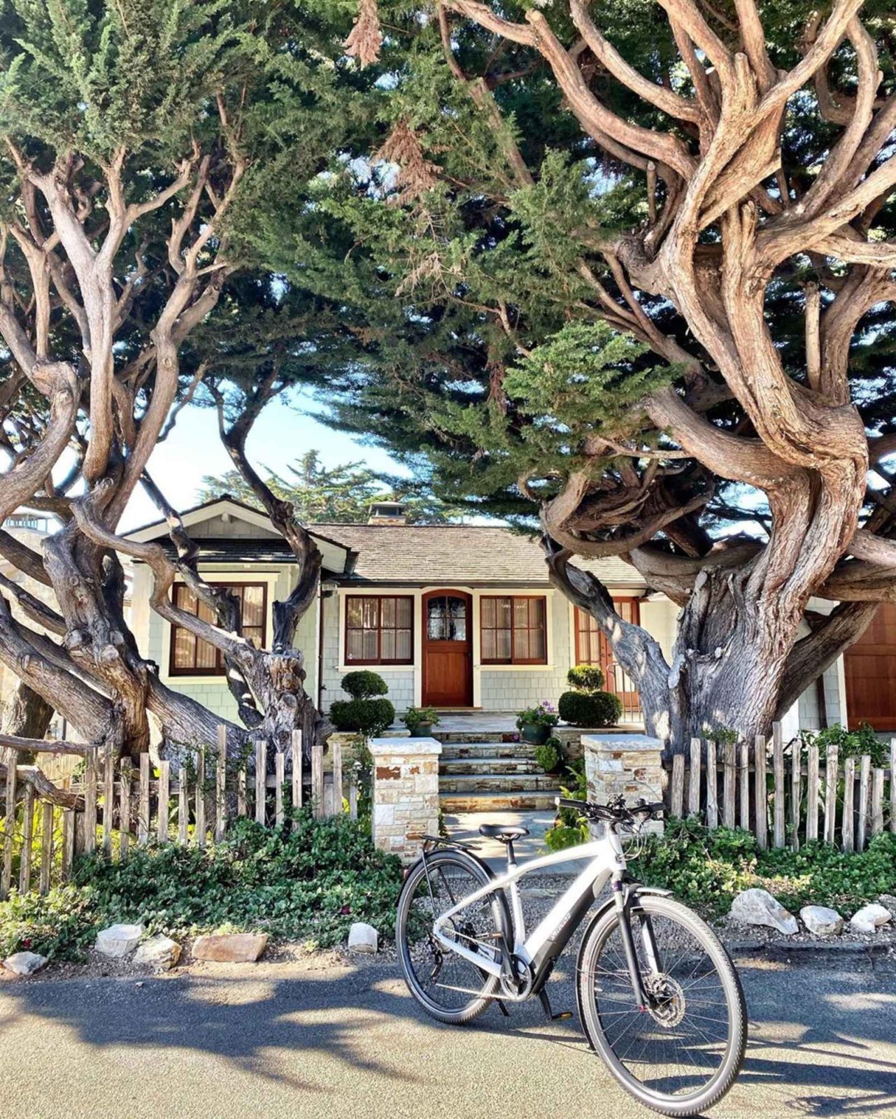 A Guide to Romance in Carmel-by-the-Sea Electric bicycle parked in front of a beautiful home in Carmel.